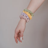 Echte Seide, zeitlose Schönheit: Das Claide Marble Scrunchie für anspruchsvolle Styles